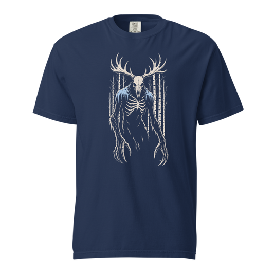 Skeletal antlered wendigo in cream and frost blue among birch trunks, printed on a true navy heavyweight tee.