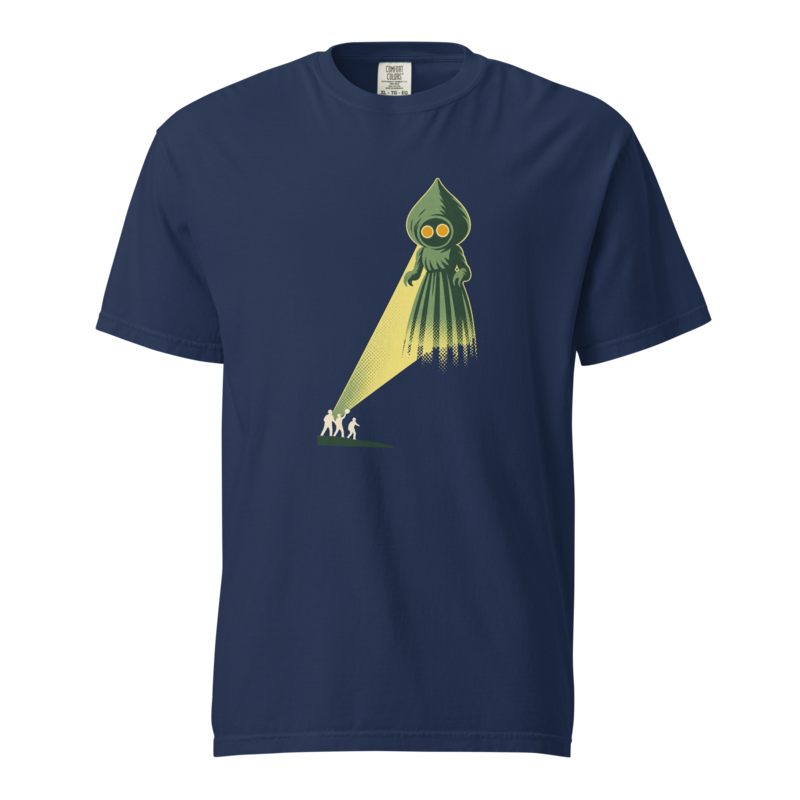 Green spade-headed Flatwoods Monster with glowing orange eyes casting a yellow beam over three small witnesses, on a true navy heavyweight tee.