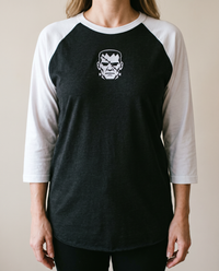 Frankenstein's Creature Raglan, Black/White, worn, chest detail, embroidered creature on Tultex 245 raglan