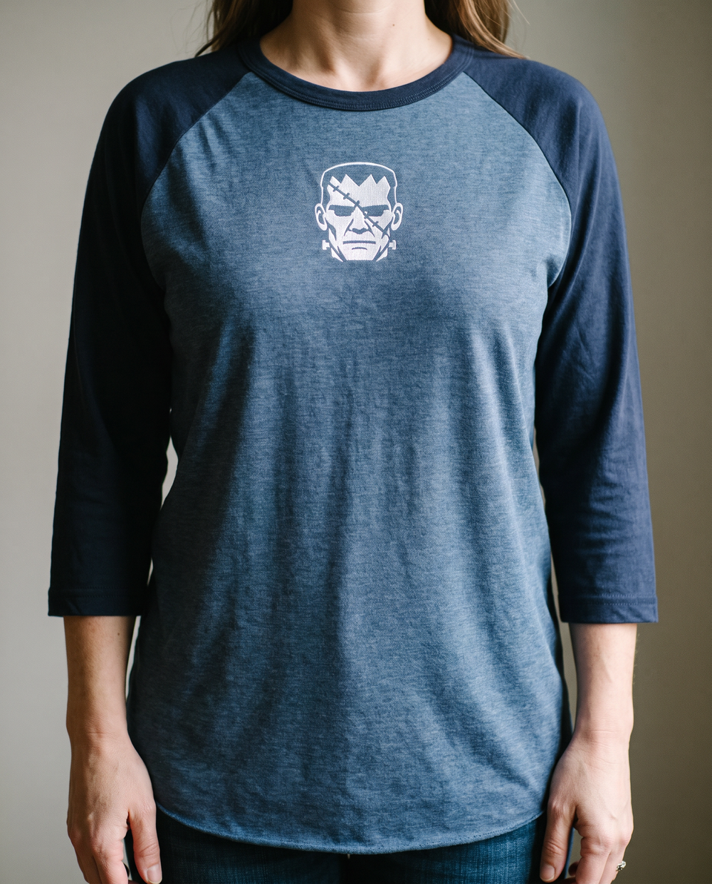 Frankenstein's Creature Raglan, Heather Denim/Navy, worn, chest detail, embroidered creature on Tultex 245 raglan