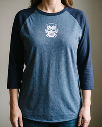 Frankenstein's Creature Raglan, Heather Denim/Navy, worn, chest detail, embroidered creature on Tultex 245 raglan