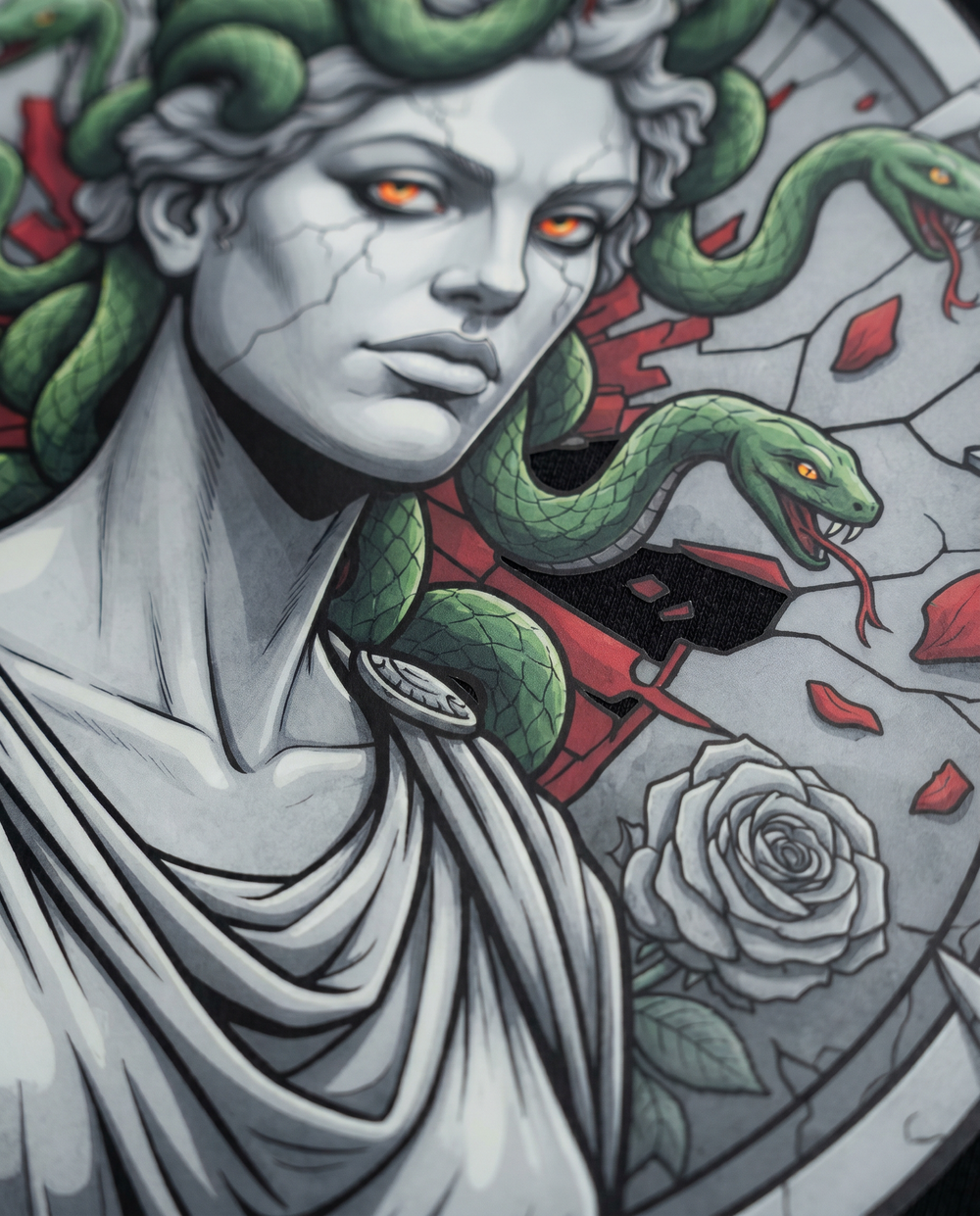 Macro closeup of the Medusa print sitting flush on black garment dyed cotton.