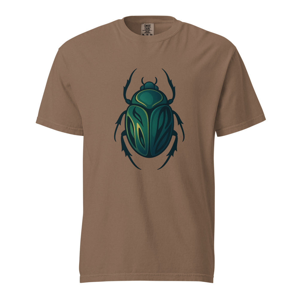 An emerald and gold Egyptian scarab beetle with a dark outline, the symbol of Khepri and rebirth, on an espresso heavyweight Comfort Colors tee.