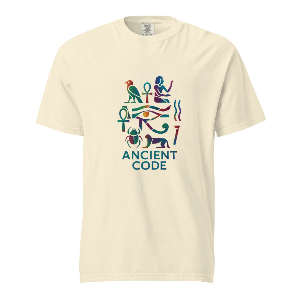 Egyptian hieroglyph collage in jewel tones, the Eye of Horus at center with the falcon of Horus, twin ankhs, a scarab, and a reclining sphinx above the words Ancient Code, on an Ivory heavyweight Comfort Colors tee.