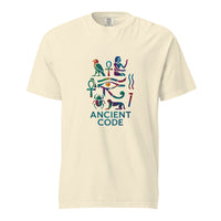 Egyptian hieroglyph collage in jewel tones, the Eye of Horus at center with the falcon of Horus, twin ankhs, a scarab, and a reclining sphinx above the words Ancient Code, on an Ivory heavyweight Comfort Colors tee.