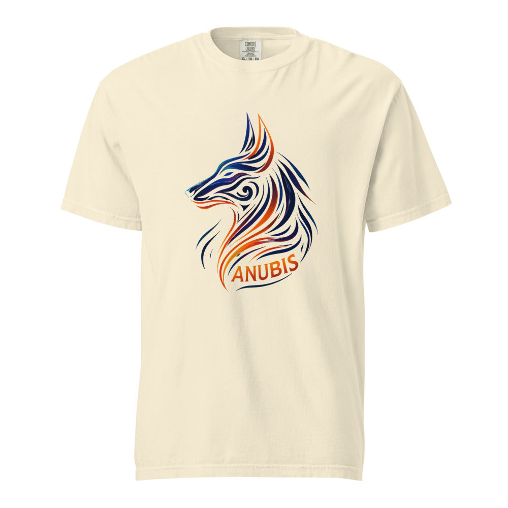 A tribal linework Anubis jackal head in deep navy and orange flame above the word Anubis, on an ivory heavyweight Comfort Colors tee.