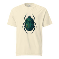 An emerald and gold Egyptian scarab beetle with a dark outline, the symbol of Khepri and rebirth, on an ivory heavyweight Comfort Colors tee.