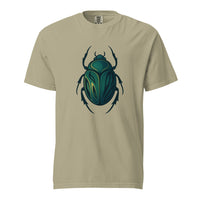 An emerald and gold Egyptian scarab beetle with a dark outline, the symbol of Khepri and rebirth, on a khaki heavyweight Comfort Colors tee.