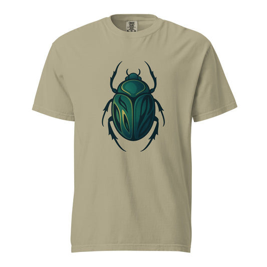 An emerald and gold Egyptian scarab beetle with a dark outline, the symbol of Khepri and rebirth, on a khaki heavyweight Comfort Colors tee.