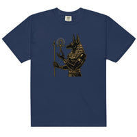 Anubis, Egyptian god of the afterlife, in black and gold holding an ankh, on a true navy heavyweight tee, front view.