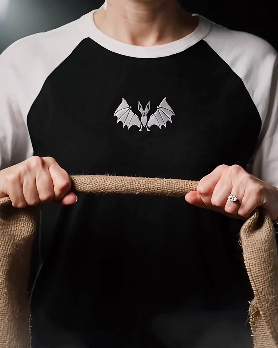 Vampire Bat Raglan, Black/White, worn, torso view, embroidered bat