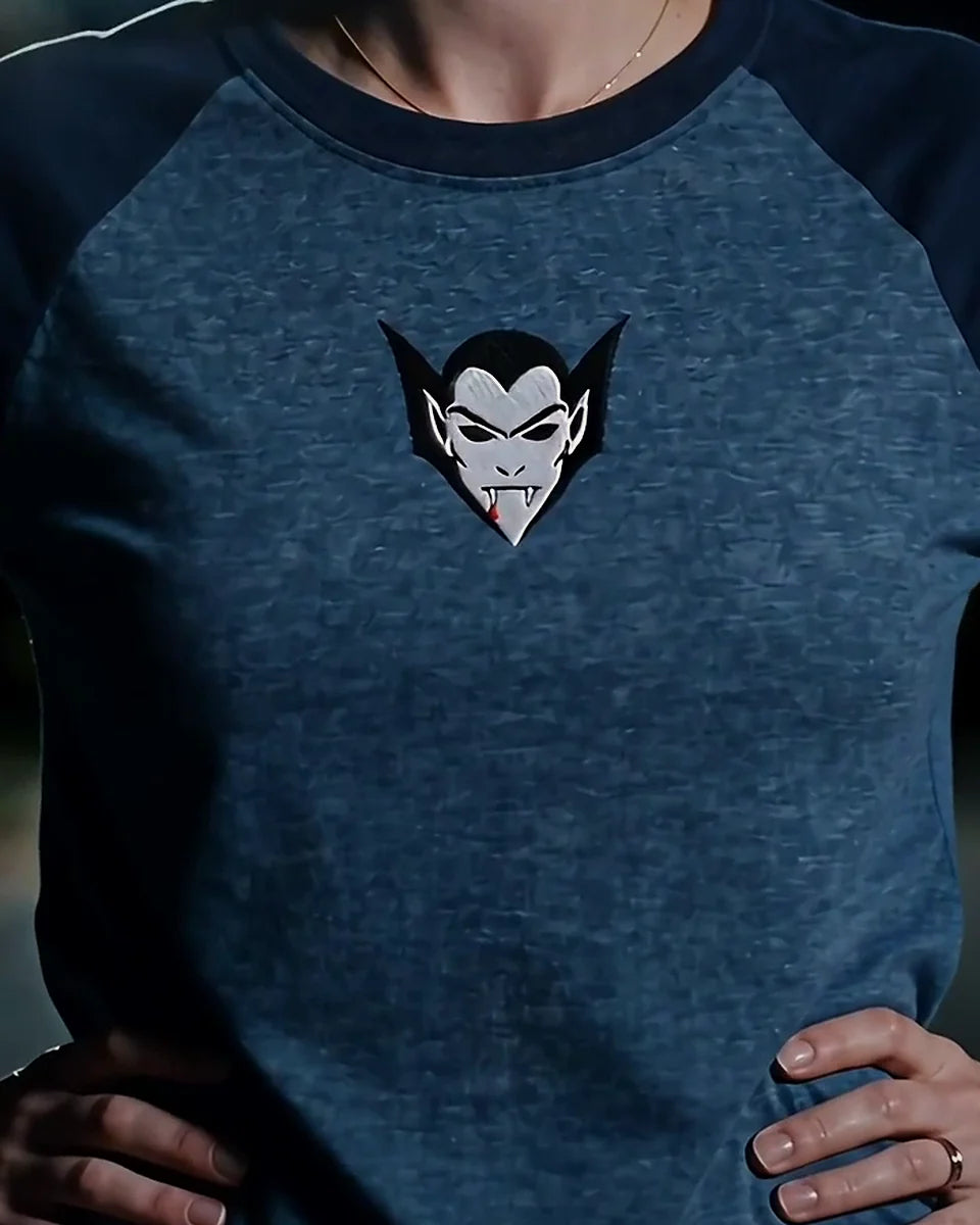Vampire Lord Raglan, Heather Denim/Navy, worn, torso view, embroidered vampire lord