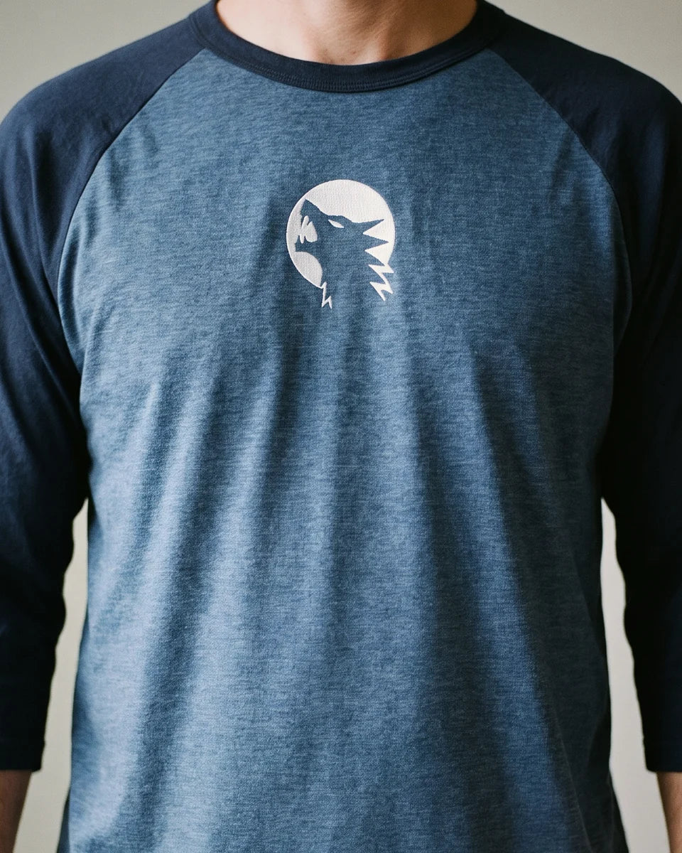 Wolf Moon Raglan, Heather Denim/Navy, worn, torso view, embroidered wolf and moon